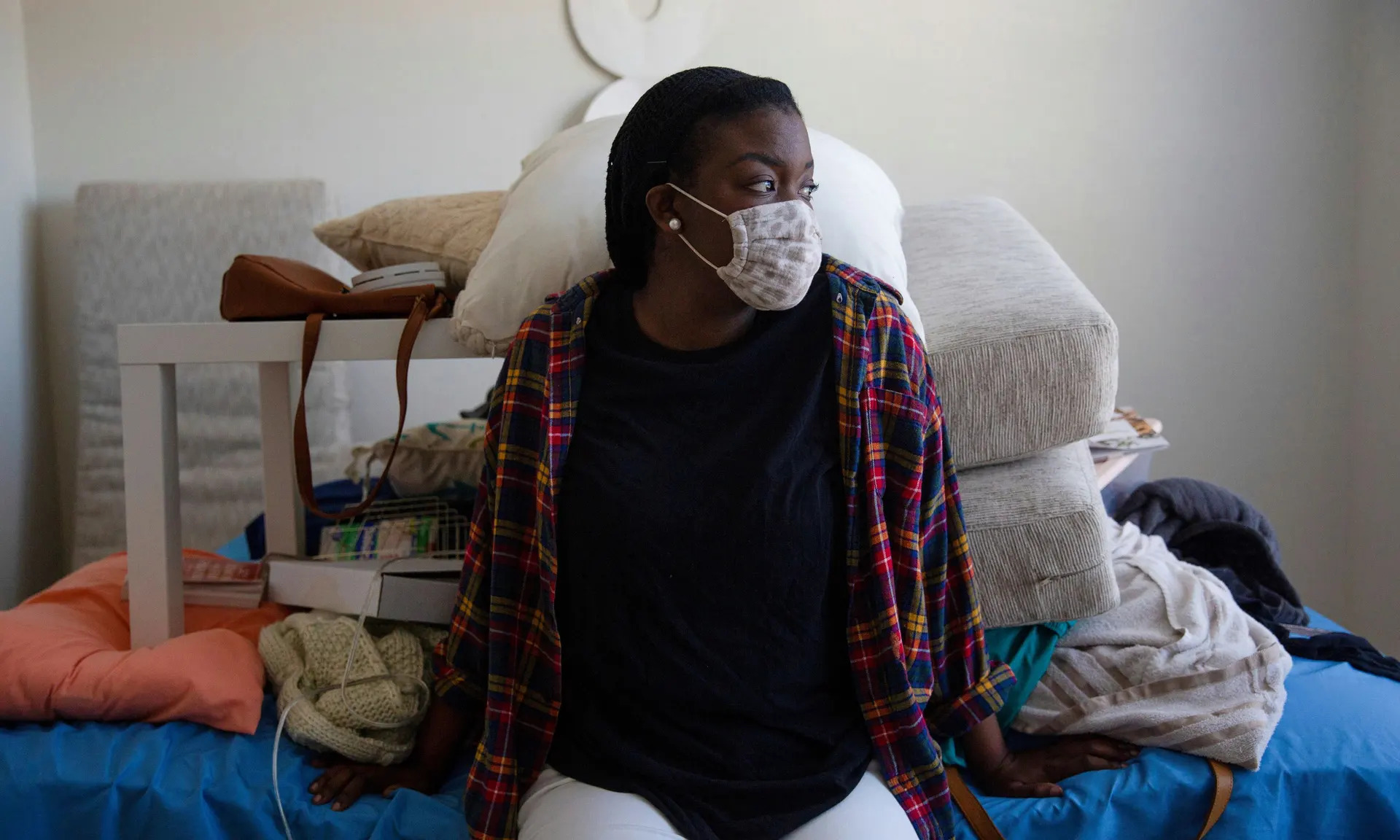 Melissa Wilson sits inside her Fort Worth apartment, in need of repair after flooding caused by a burst pipe. Photograph: Shelby Tauber/Reuters 
